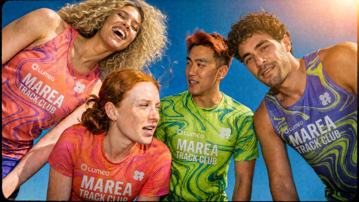 Five smiling runners in jerseys with fluid, colorful graphics