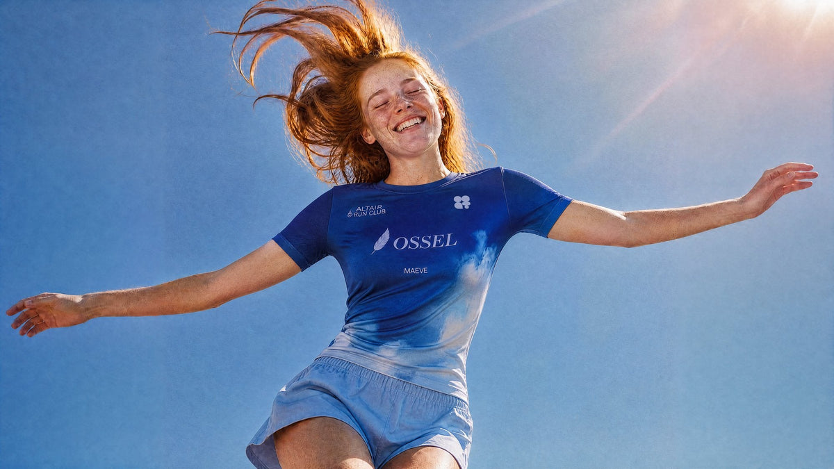 Runner jumping with joy in a blue gradient jersey