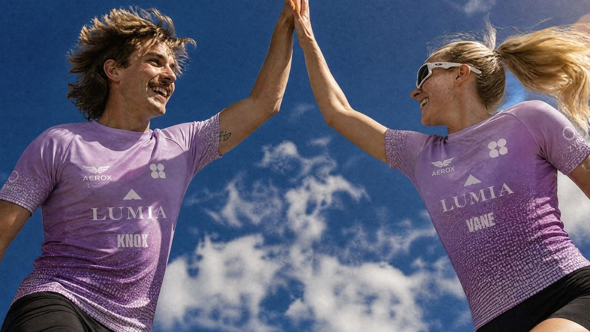 Two athletes high-fiving in purple jerseys